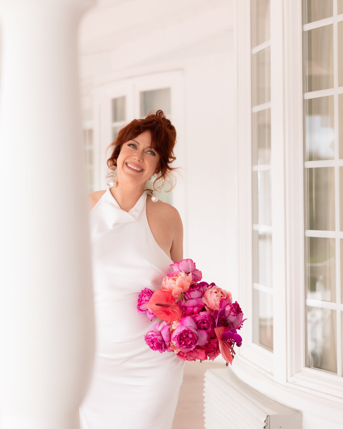 Madonna Inn wedding photos of bride portraits with colorful pink bouquet in San Luis Obispo