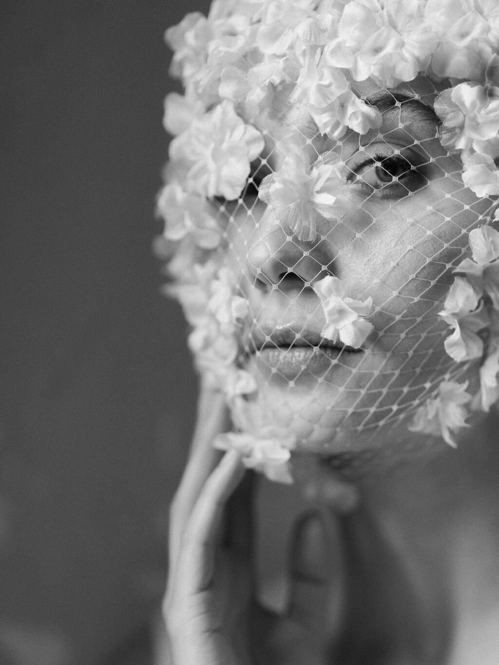 close up of bride wearing floral veil headpiece