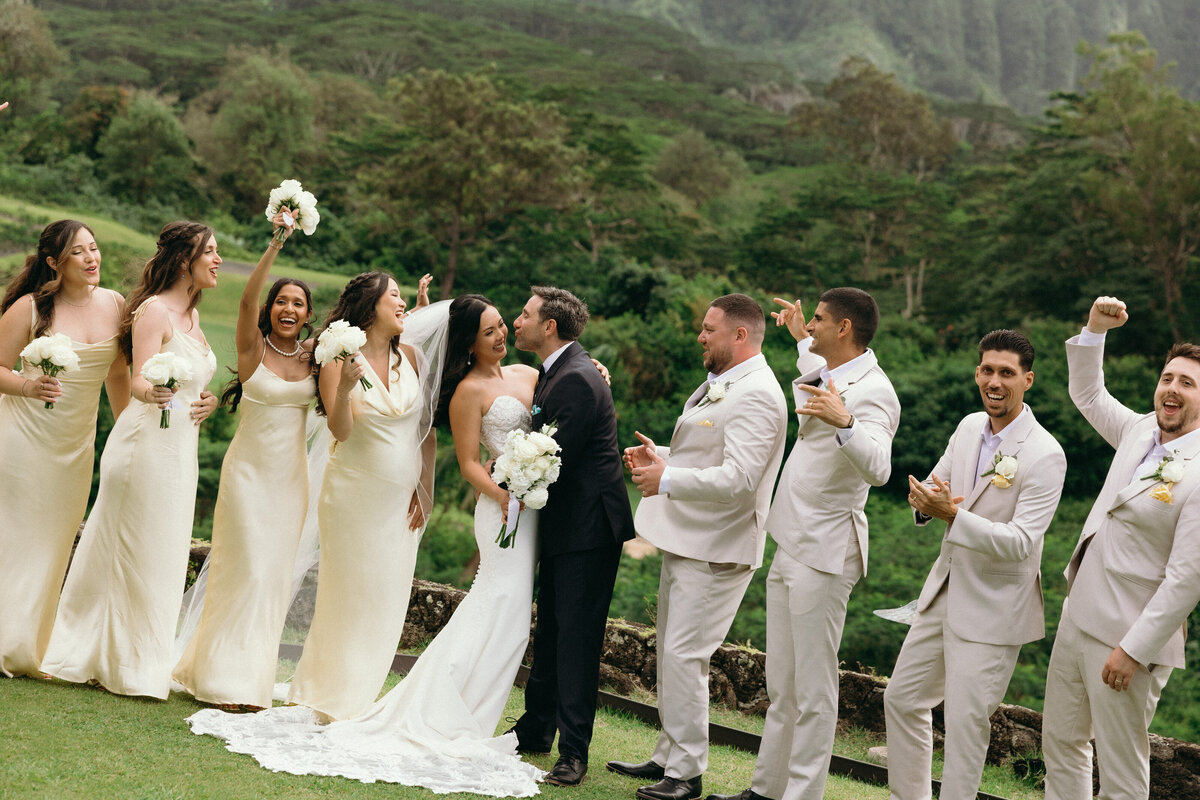 Bride and groom exchanging vows at sunset on the beach in Oahu, Hawaii