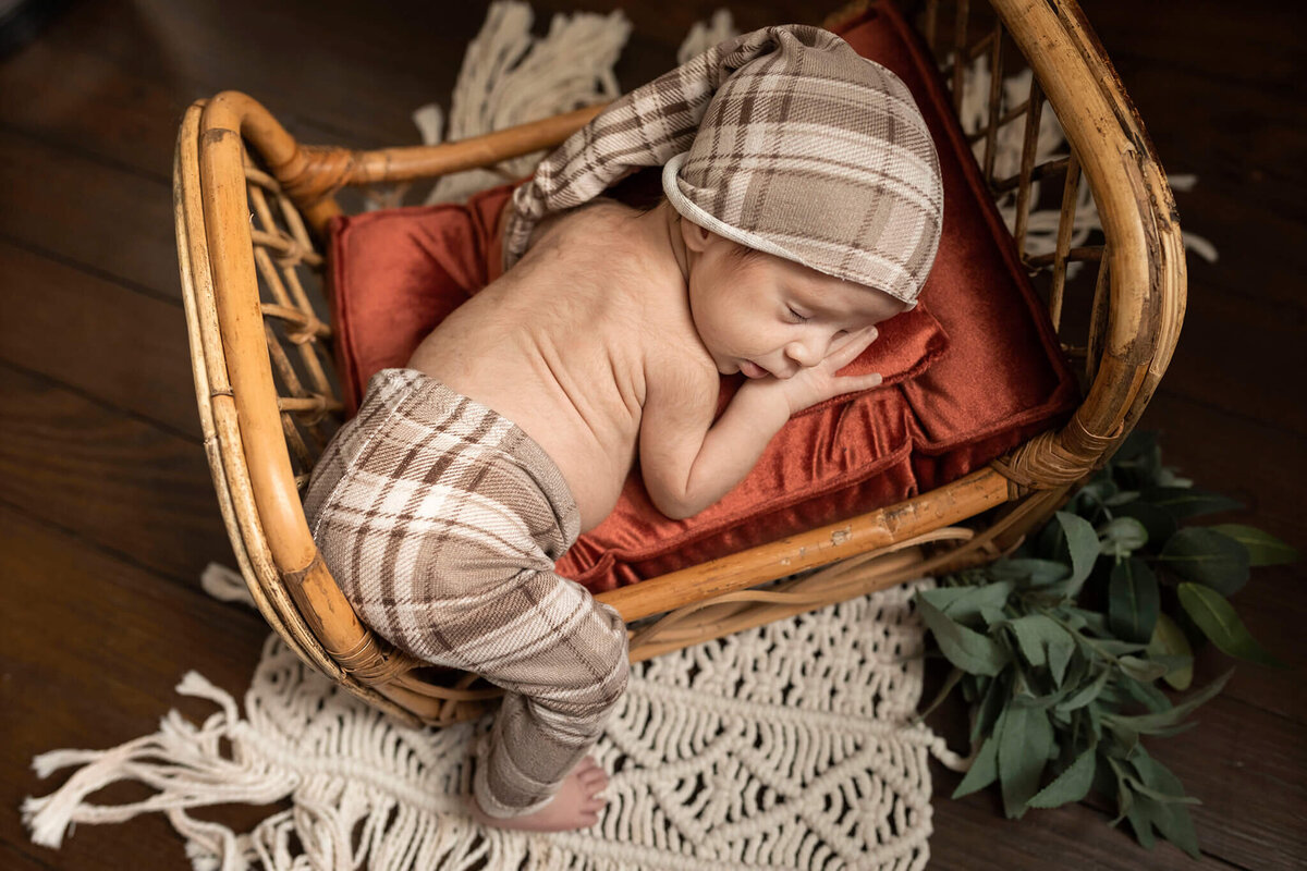 NJ baby photographer poses baby on tiny bed