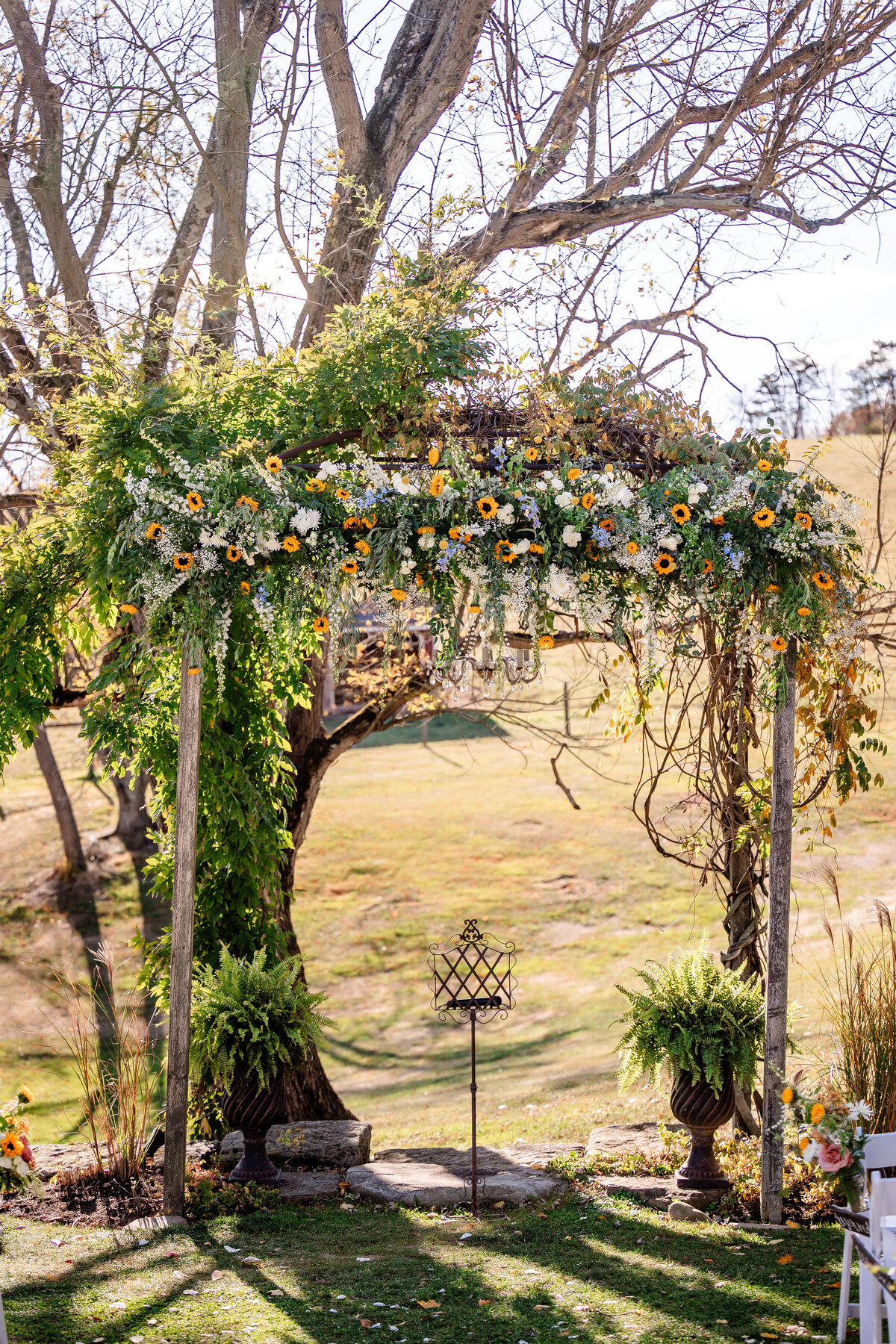 ceremony site at shady elms farm with the setup floral arch