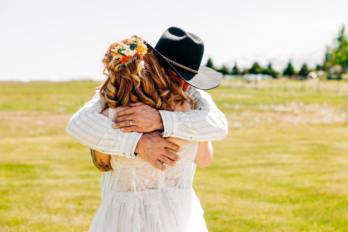 Father bride hug during first look at Homestead on McVey in Victor, MT