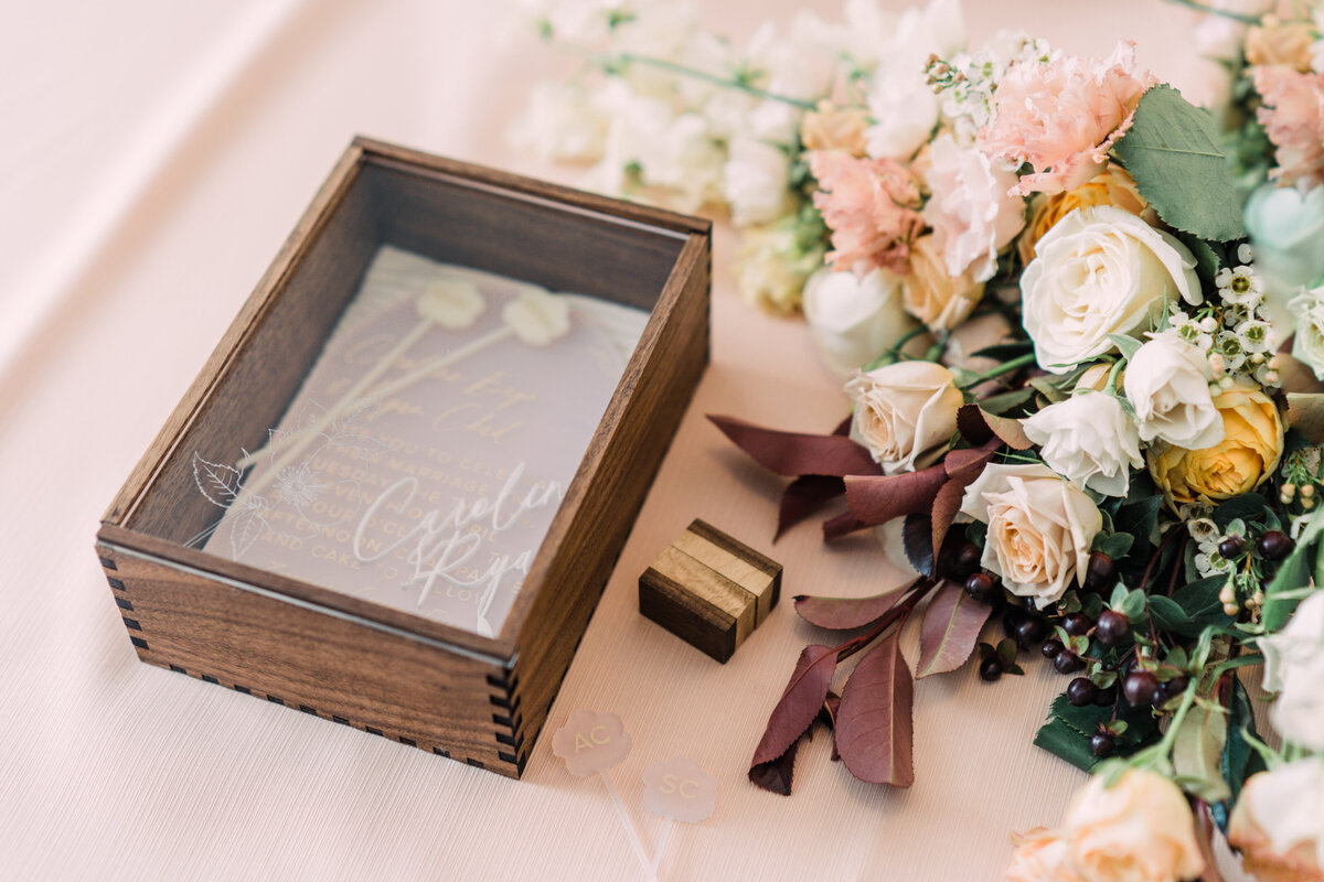 Custom Focus and Light walnut & engraved acrylic wedding keepsake box, wood ring box, & bridal bouquet on pink background