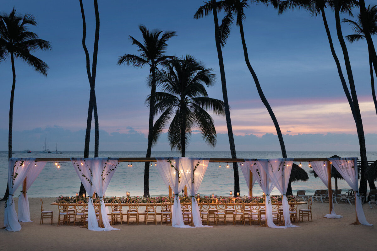 sunset on the beach at a wedding reception