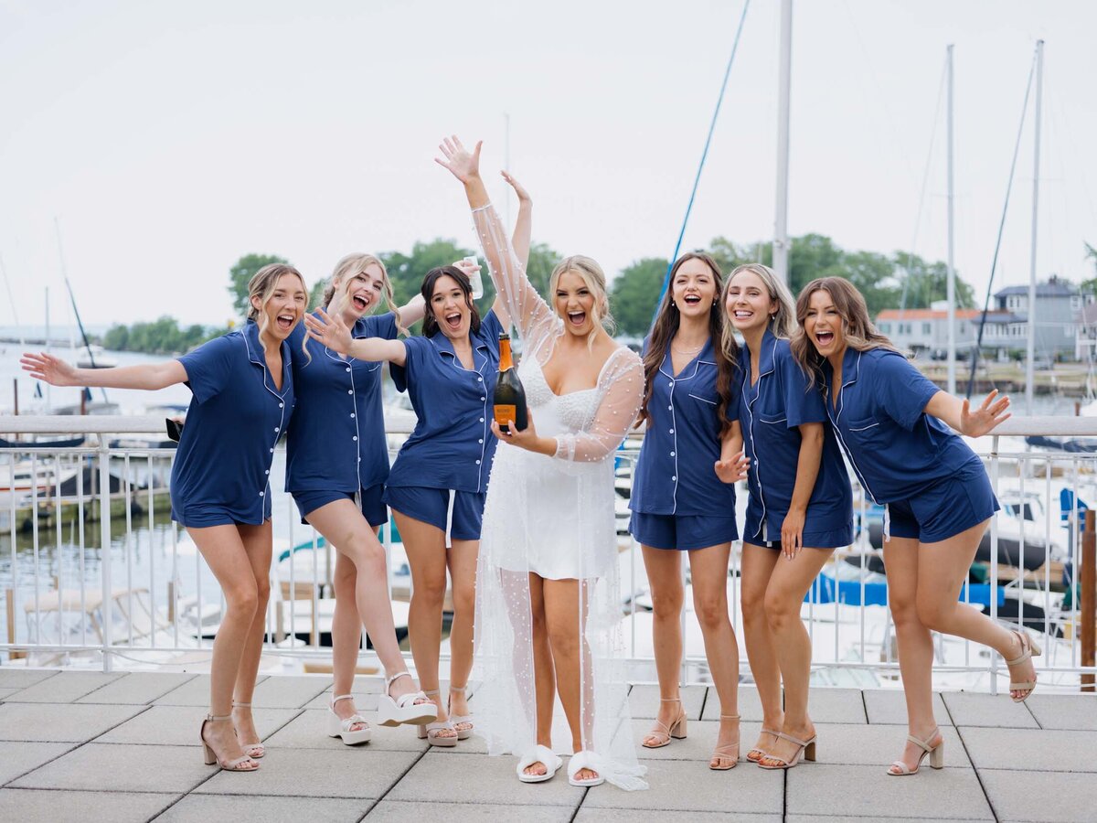 Bride with bridesmaids in matching blue pj's at Cleveland Yachting Club