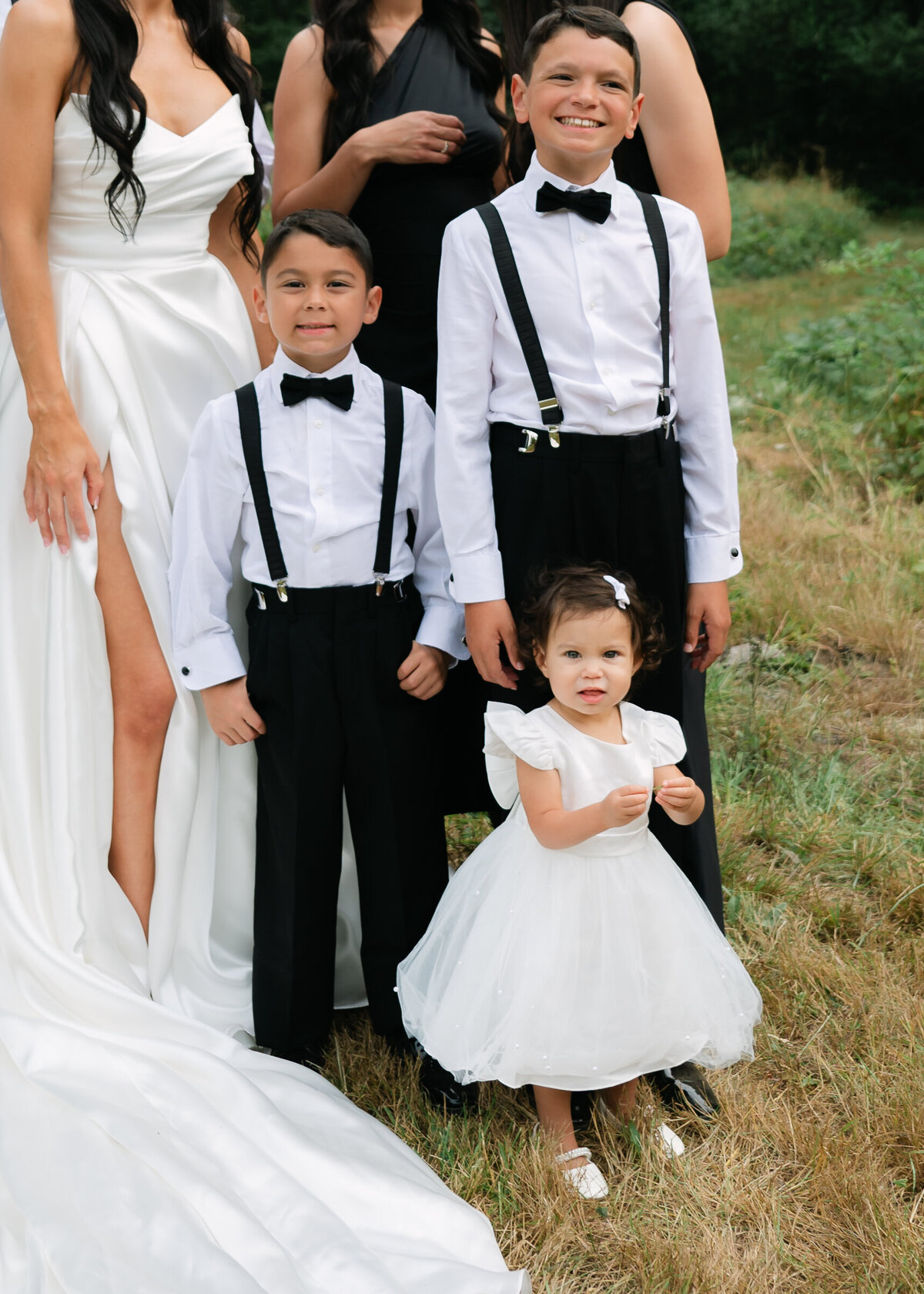 up close image of ring bearers and flower girl at outdoor wedding