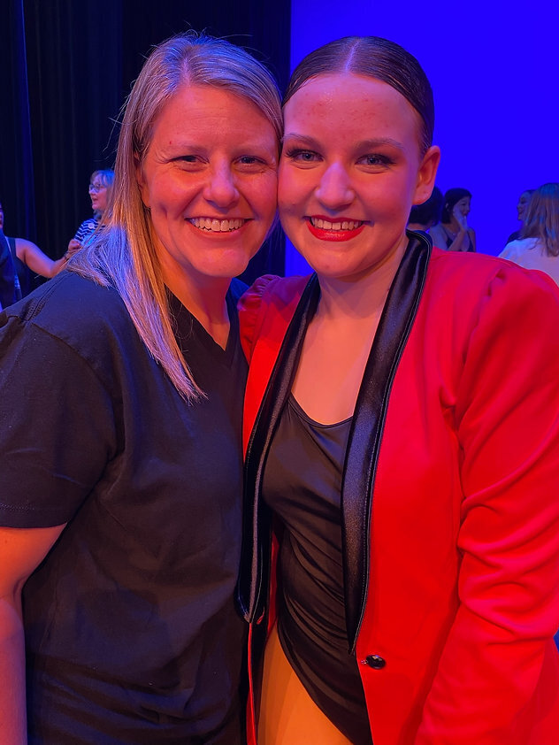 High school dancer with miss marcie after razzle dazzle at recital