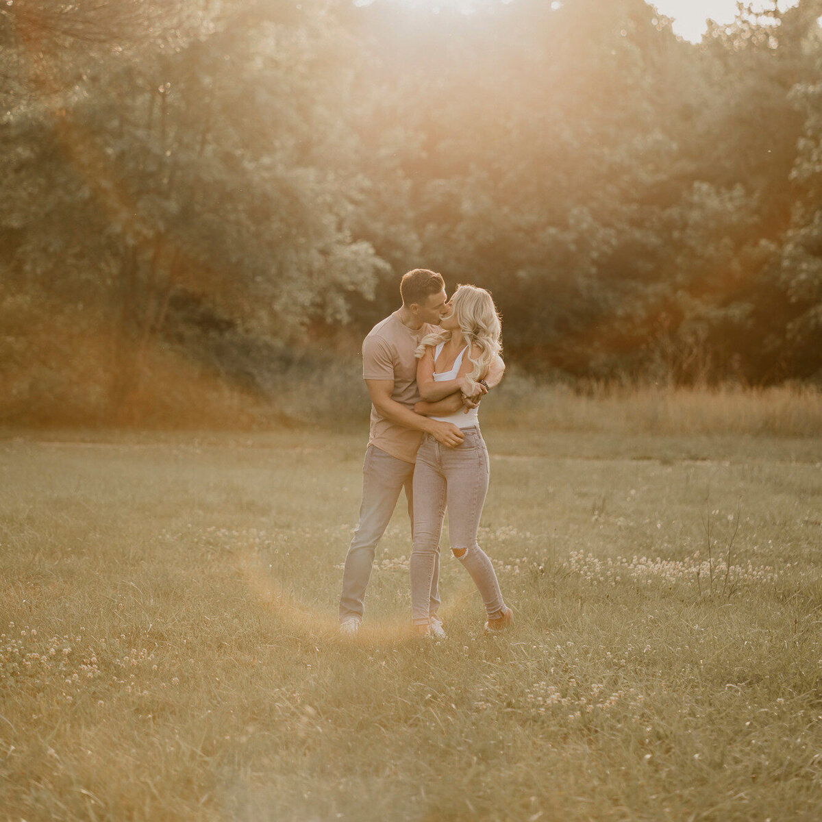 Sunny engagement portrait in the summer