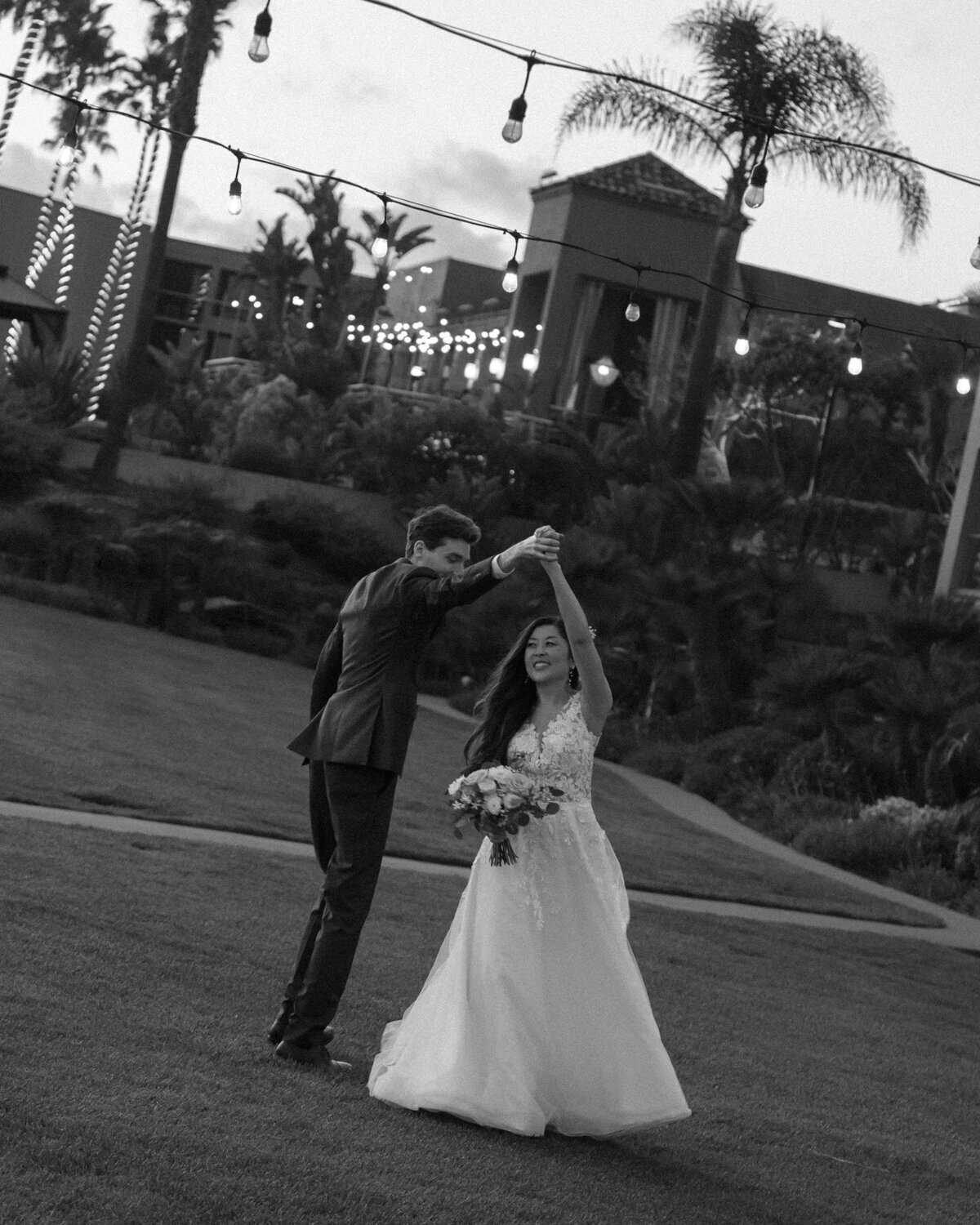 candid black and white Wedding Photos of couple dancing on beach in Pismo Beach at Dolphin Bay Resort & Spa
