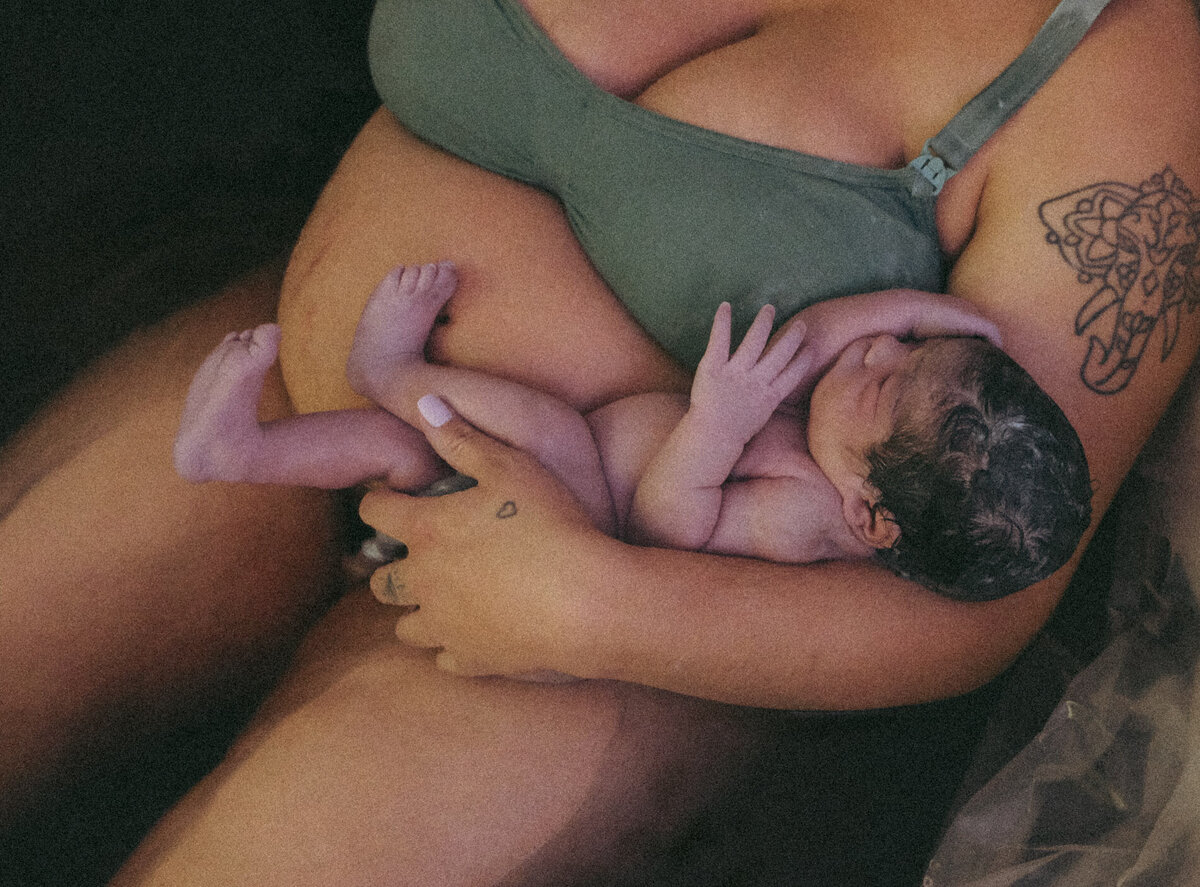 newborn-in-moms-arms