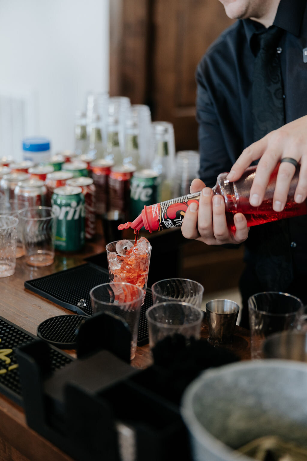 Bartender pouring drinks at the bar