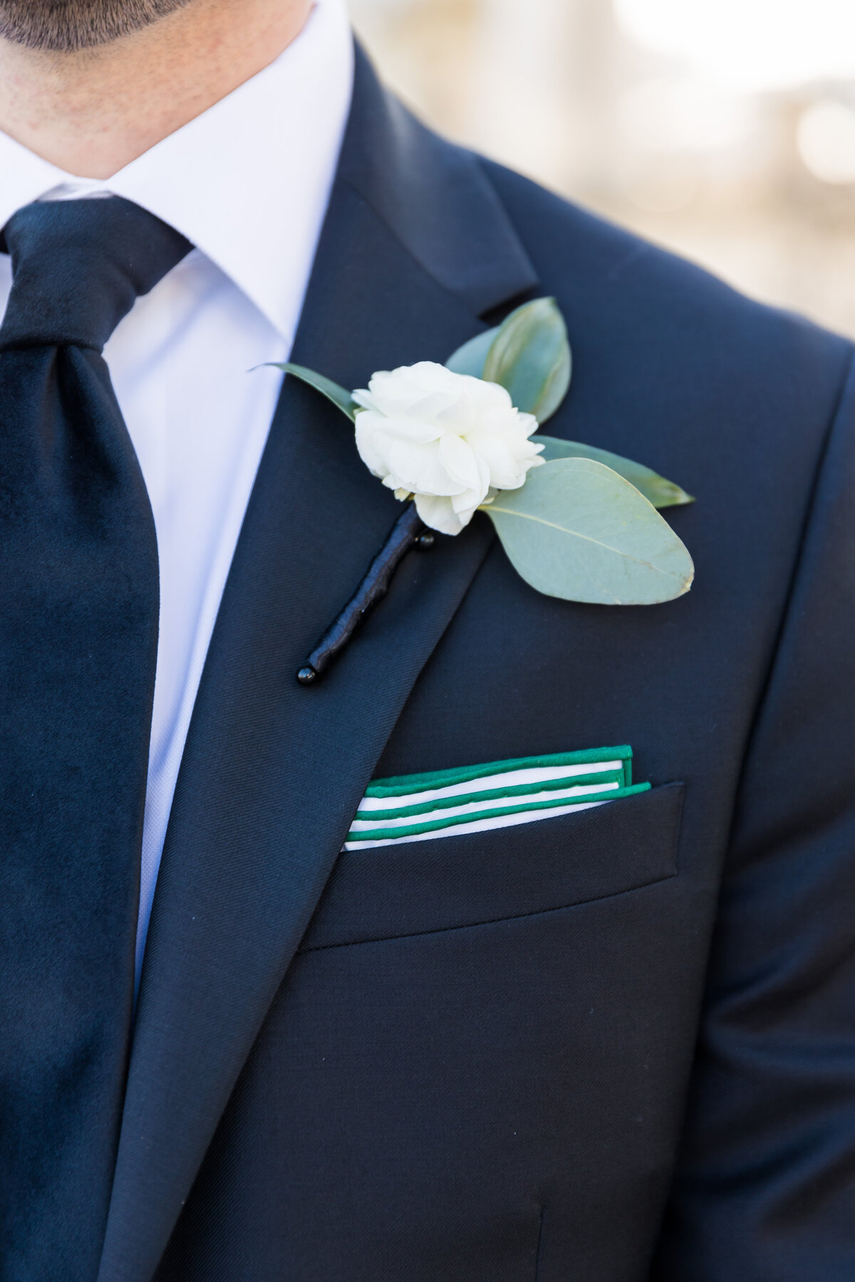 Grooms suit with single flower attached