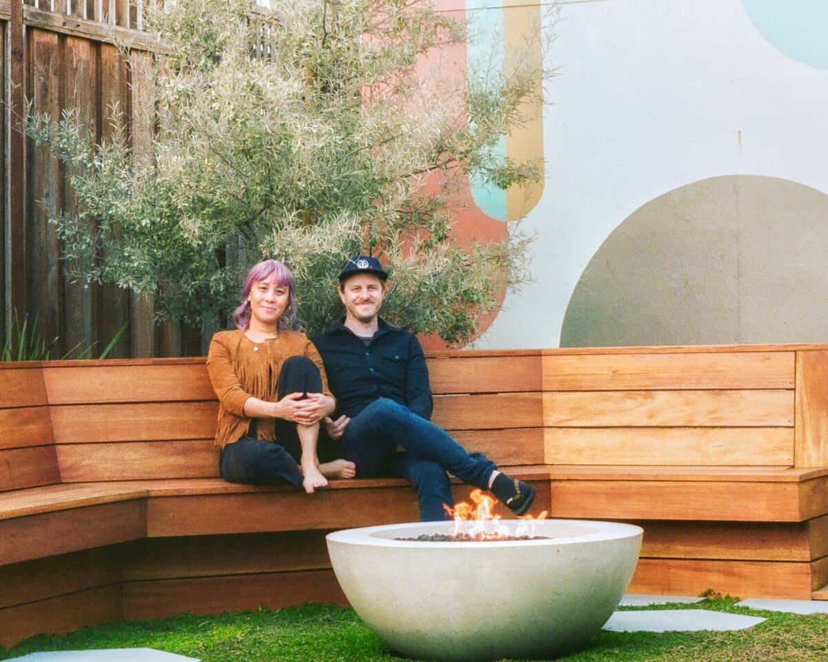 Oakland couple pose in their backyard