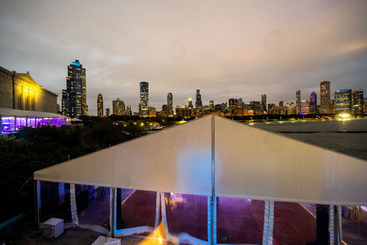 Tent structure with Chicago skyline in the background