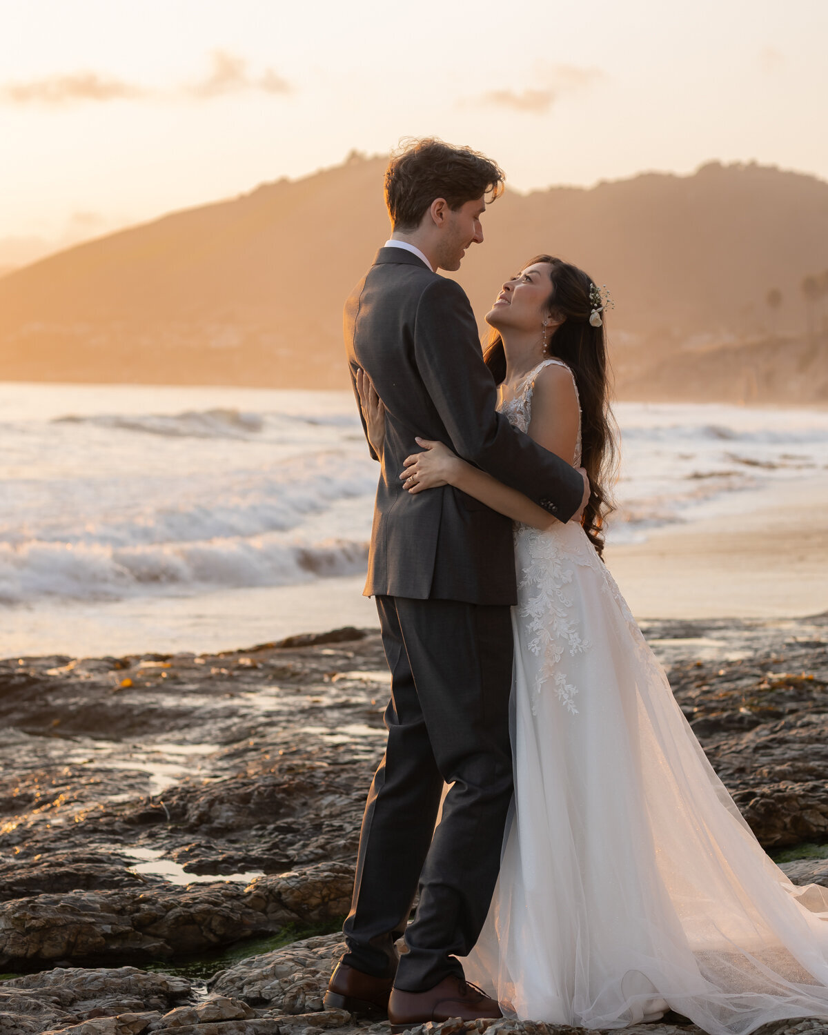 candid Wedding Photos of couple holding hands on beach in Pismo Beach