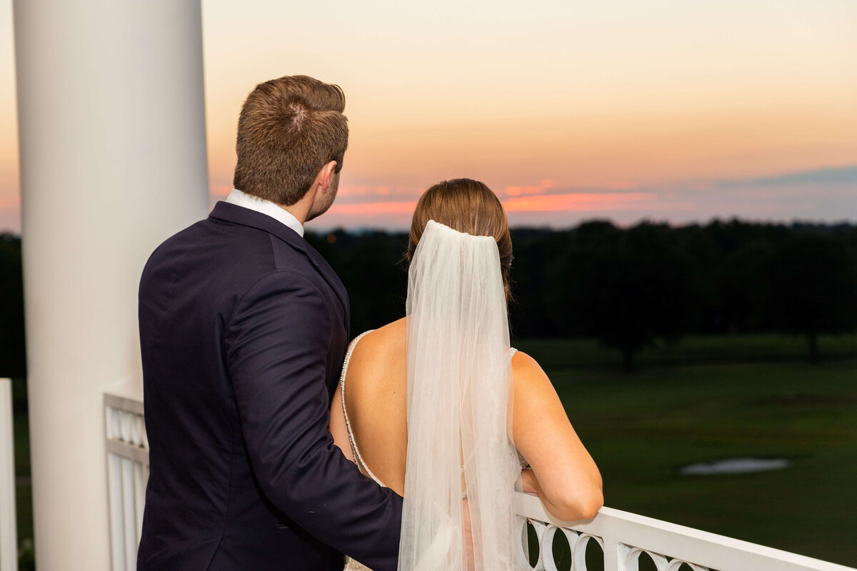 Bride and groom watching the sunset at Stones River Country Club wedding