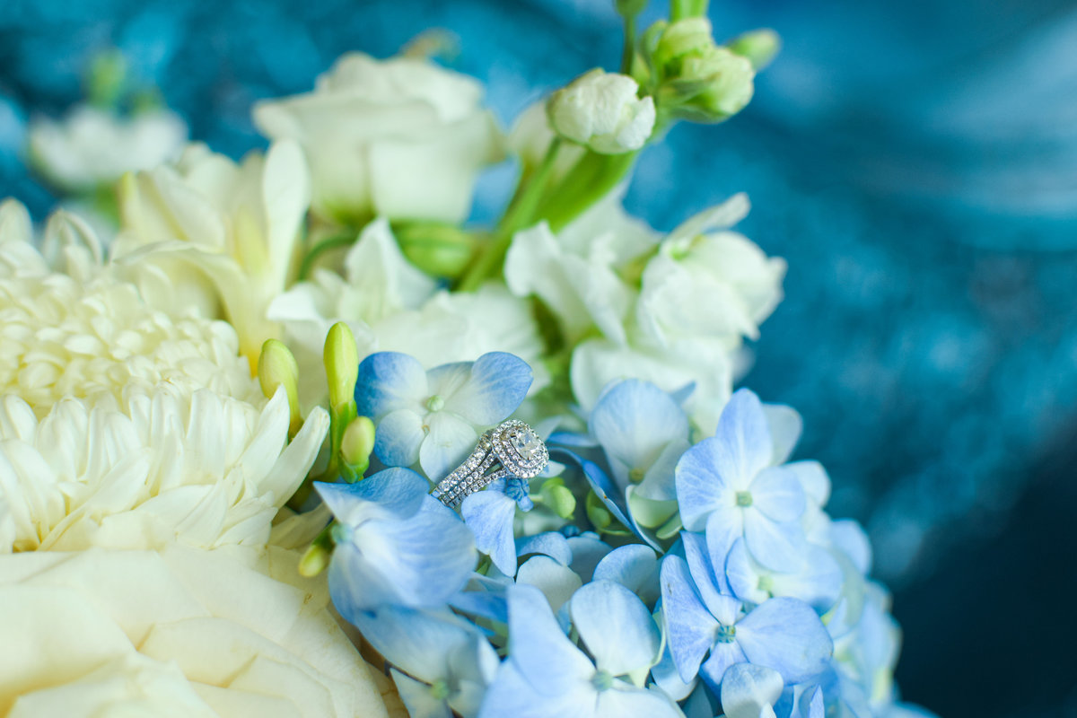 Round Cut halo engagement ring and bouquet One Ocean Resort Jacksonville Florida
