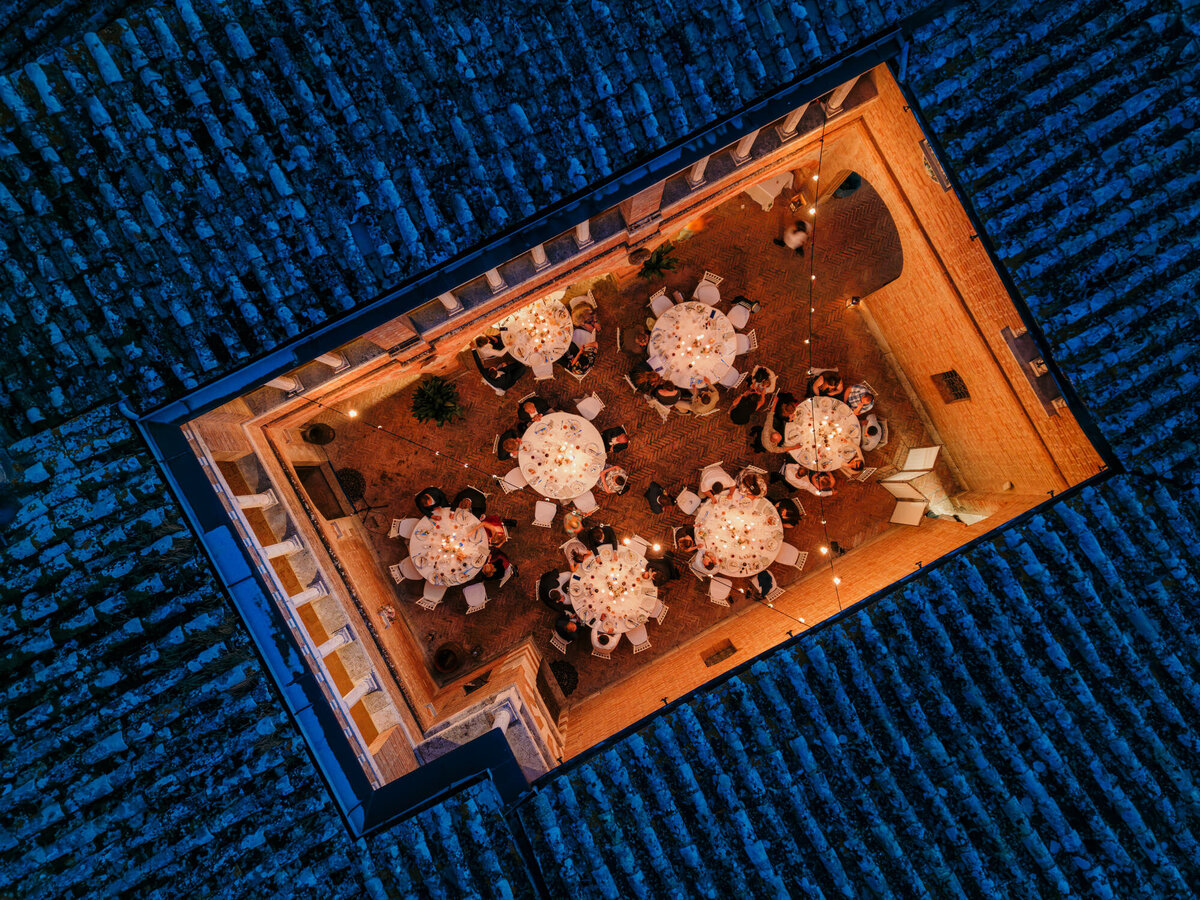 Drone wedding photographyof the wedding venues inner courtyard during celebration.