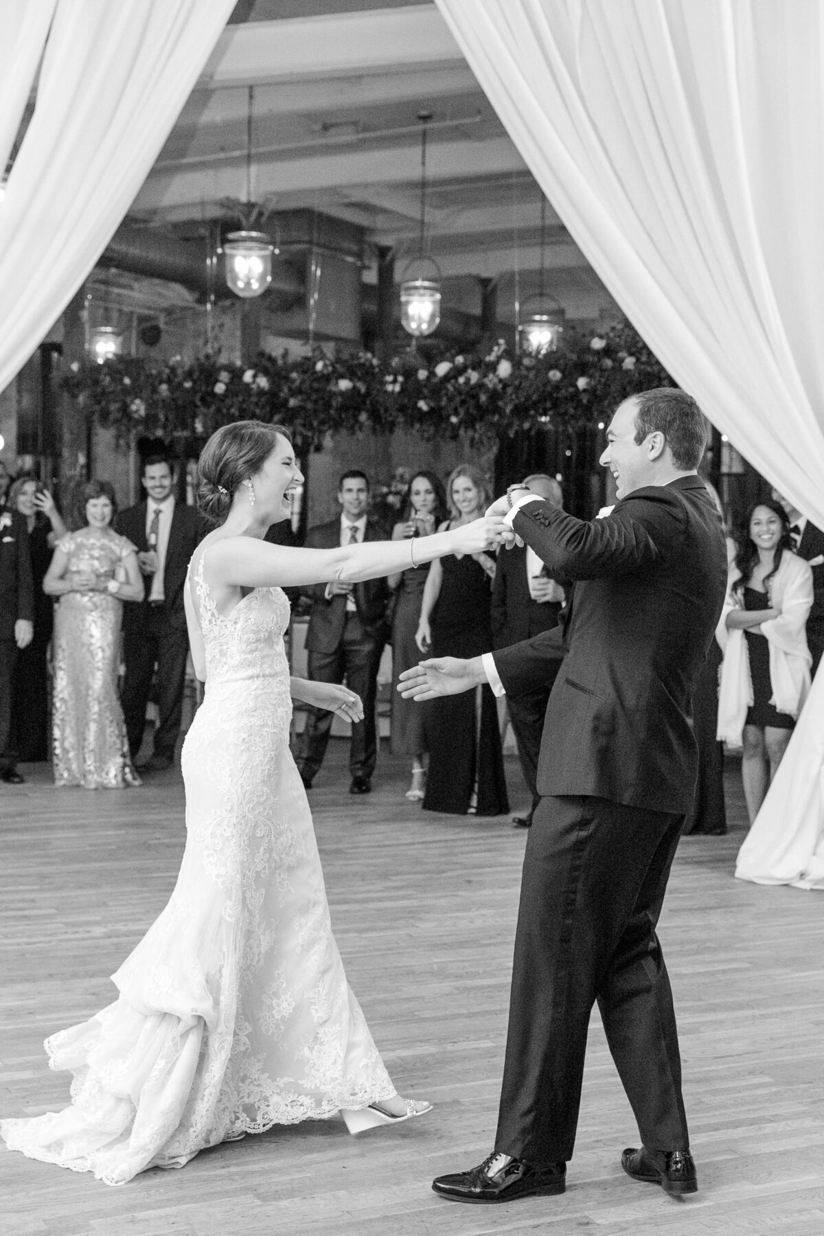 Bride and groom during first dance at wedding in Charleston by destination wedding photographer Dana Cubbage.