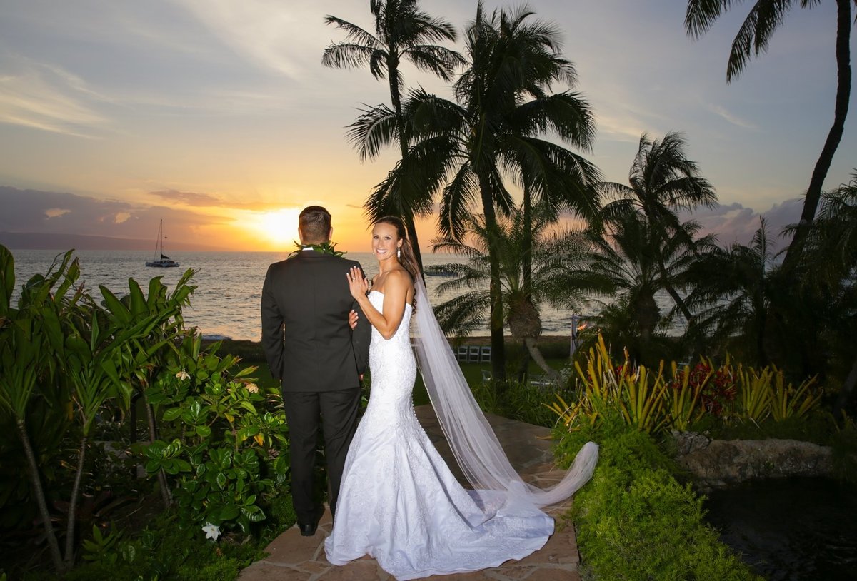 Maui Wedding Photography at The Westin Maui Resort and Spa of the  bride and groom posing at sunset