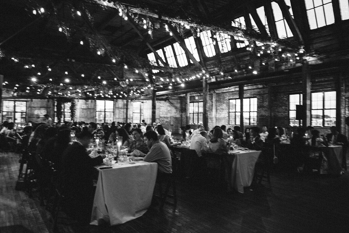 Mira Park Photography NY based wedding photographer Black and white photo of wedding reception at Greenpoint Loft in Brooklyn, NY