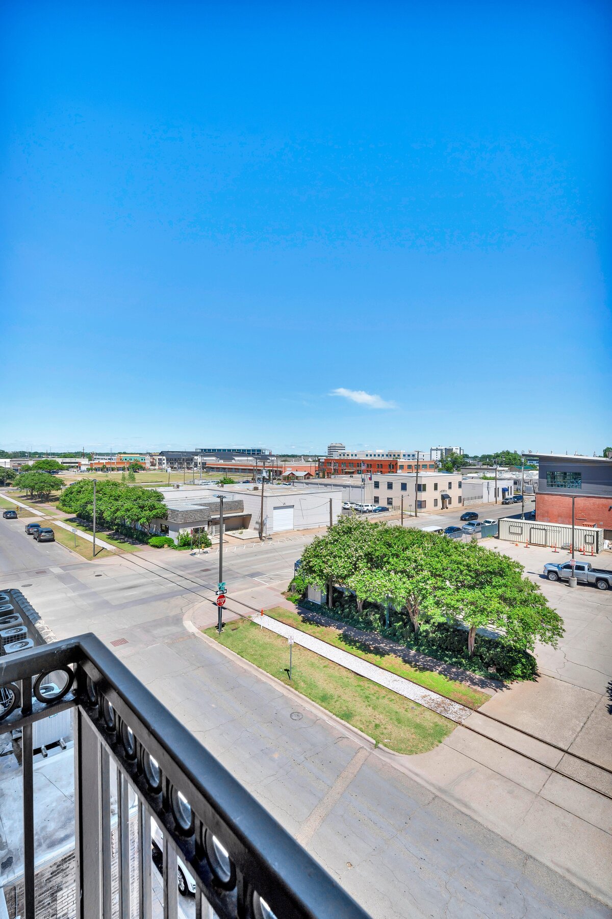 Third floor view from the balcony of this one-bedroom, one-bathroom vintage condo that sleeps 4 in the historic Behrens building in the heart of the Magnolia Silo District in downtown Waco, TX.
