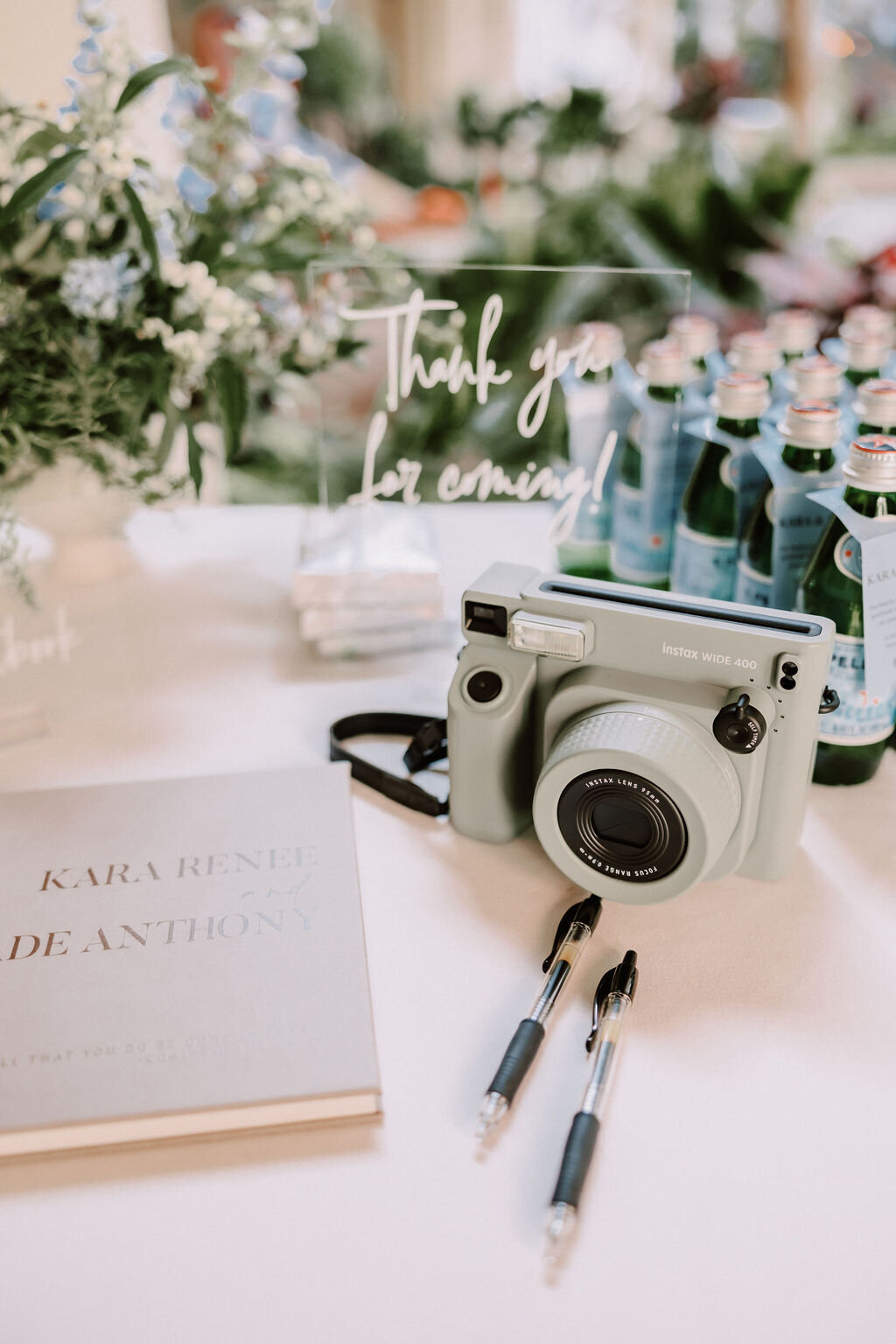 table camera, film and with various signs on it and ceremony chairs in the background with european architecture
