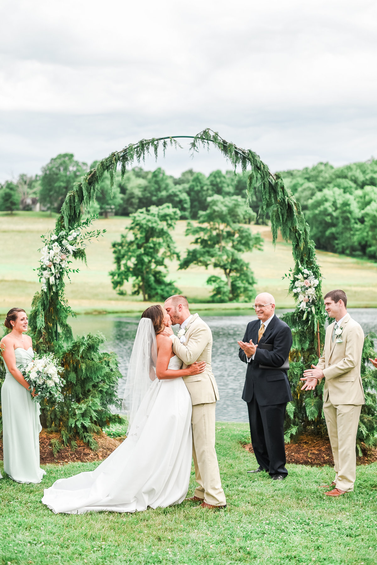 First kiss overlooking ceremony space at stone ridge hollow maryland