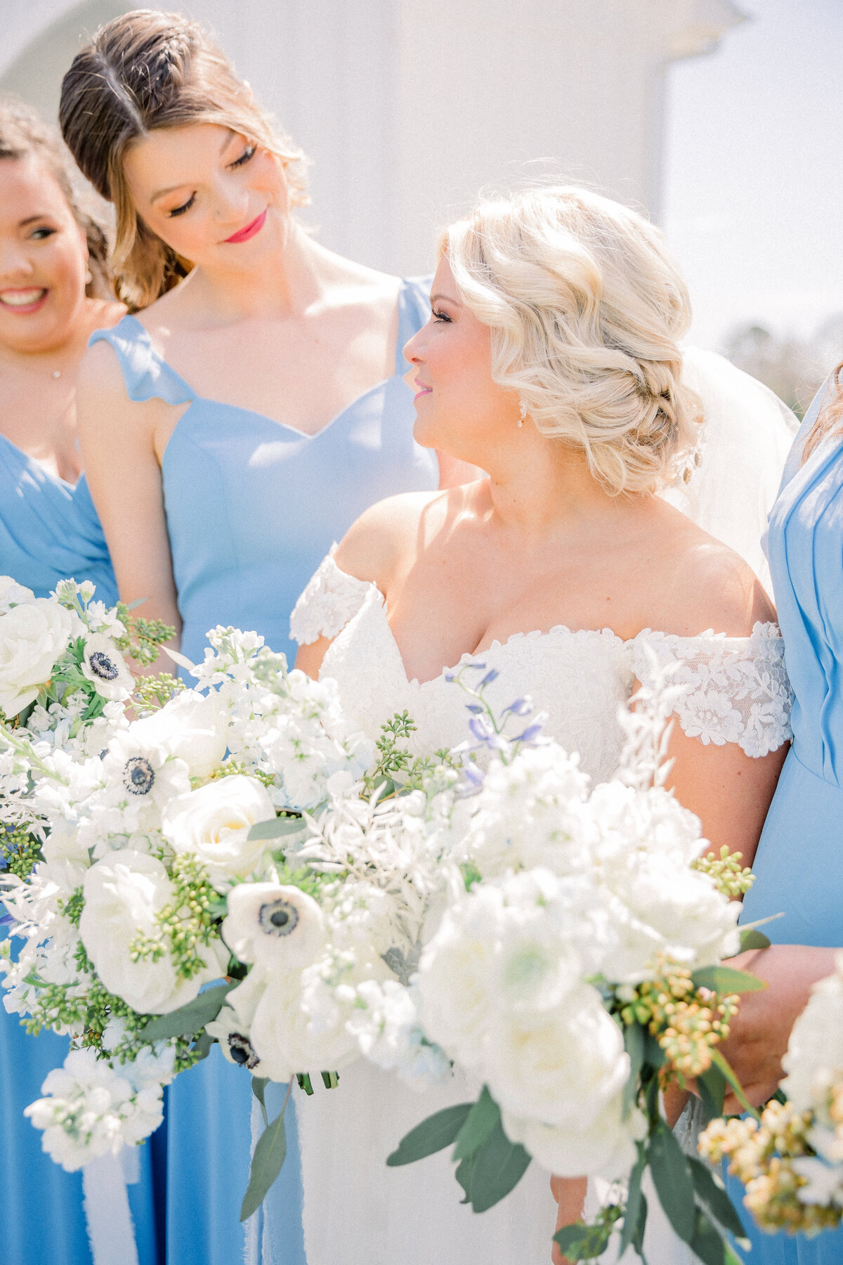 Bride and bridesmaids portraits outside of a beautiful chapel