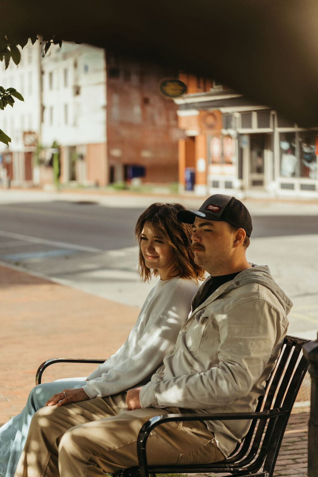 Photo of couple sitting on bench together