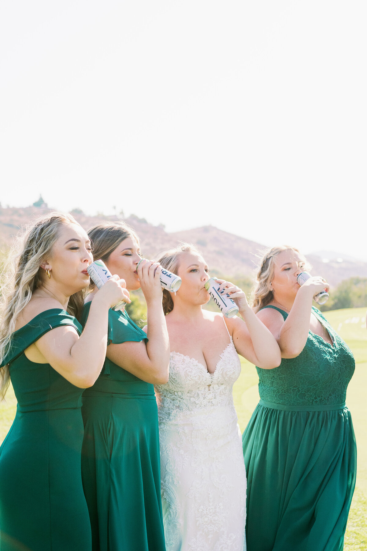 Bride and Bridesmaids pose for  drinking truly's Norco Ca