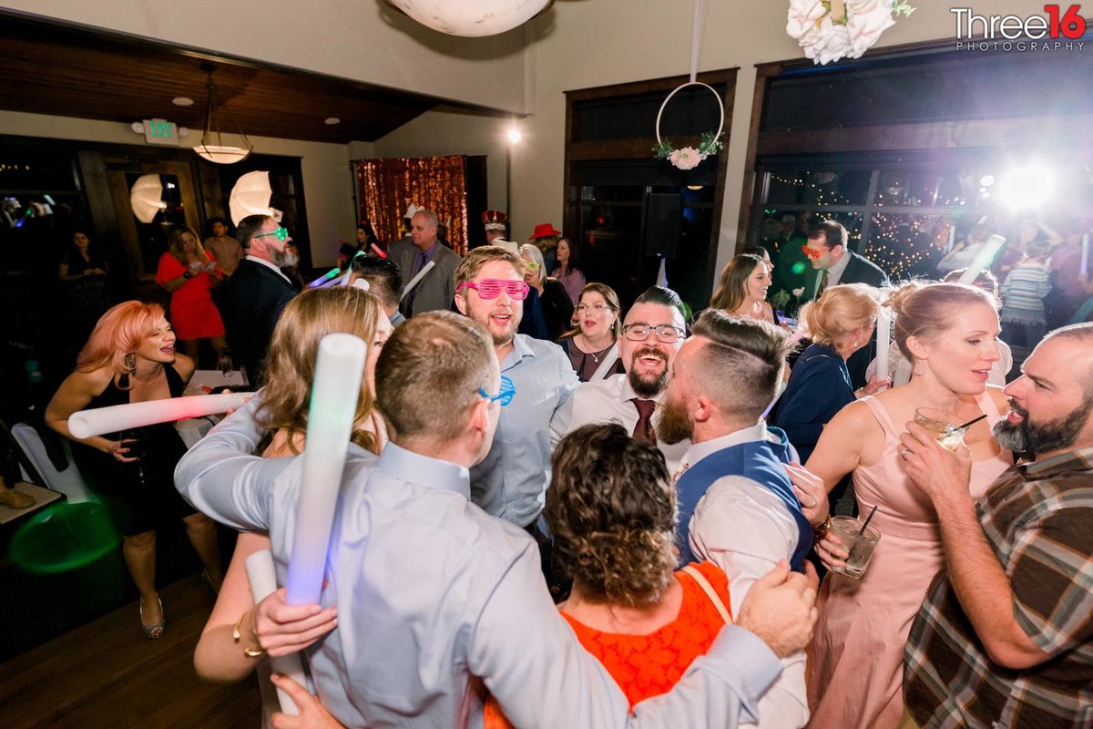 Bride and Groom dance with wedding guests