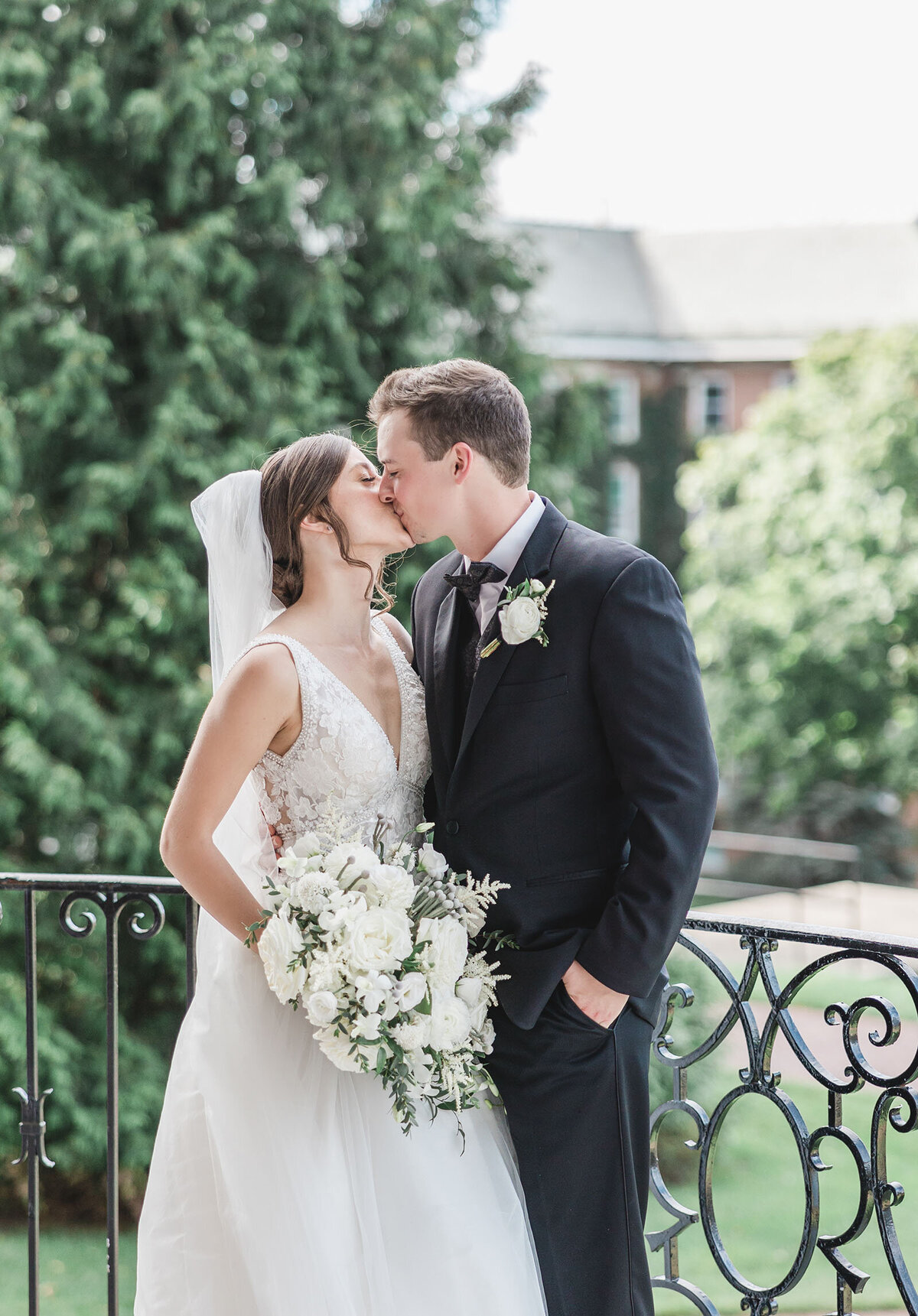 A newly wed couple share  a kiss