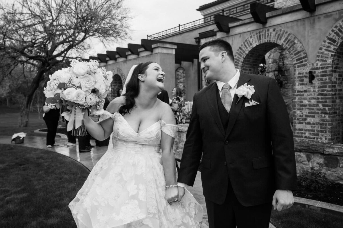 couple-laughing-with-each-other-after-ceremony