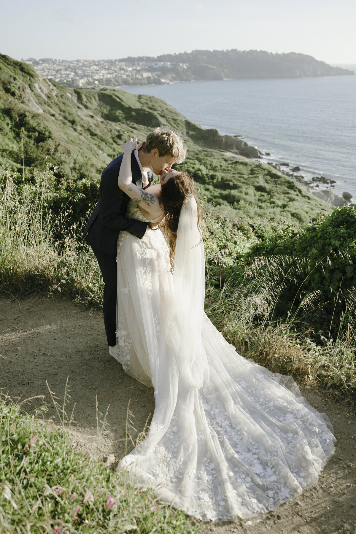 Bride and Groom at Marshall's Beach in San Francisco, California at sunset