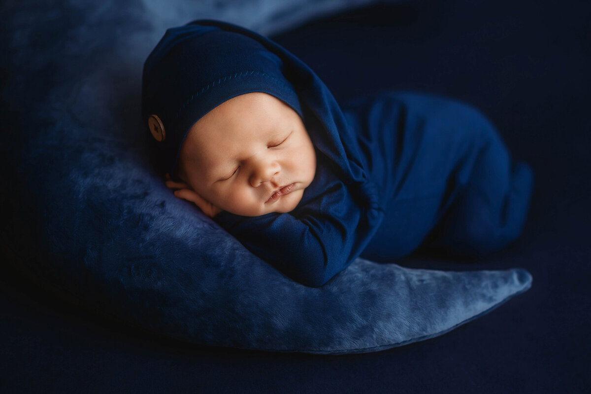 Infant posed for Newborn Photos in Charleston.
