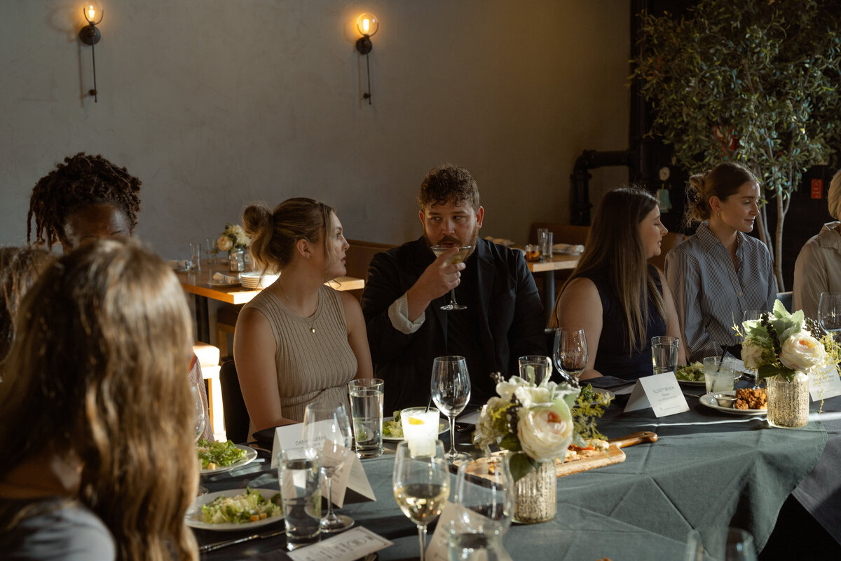 guest-sipping-drink-conversation-networking-dinner-stirr-dallas