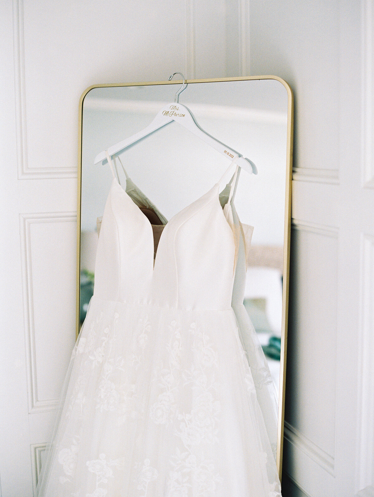 wedding-dress-hanging-on-mirror