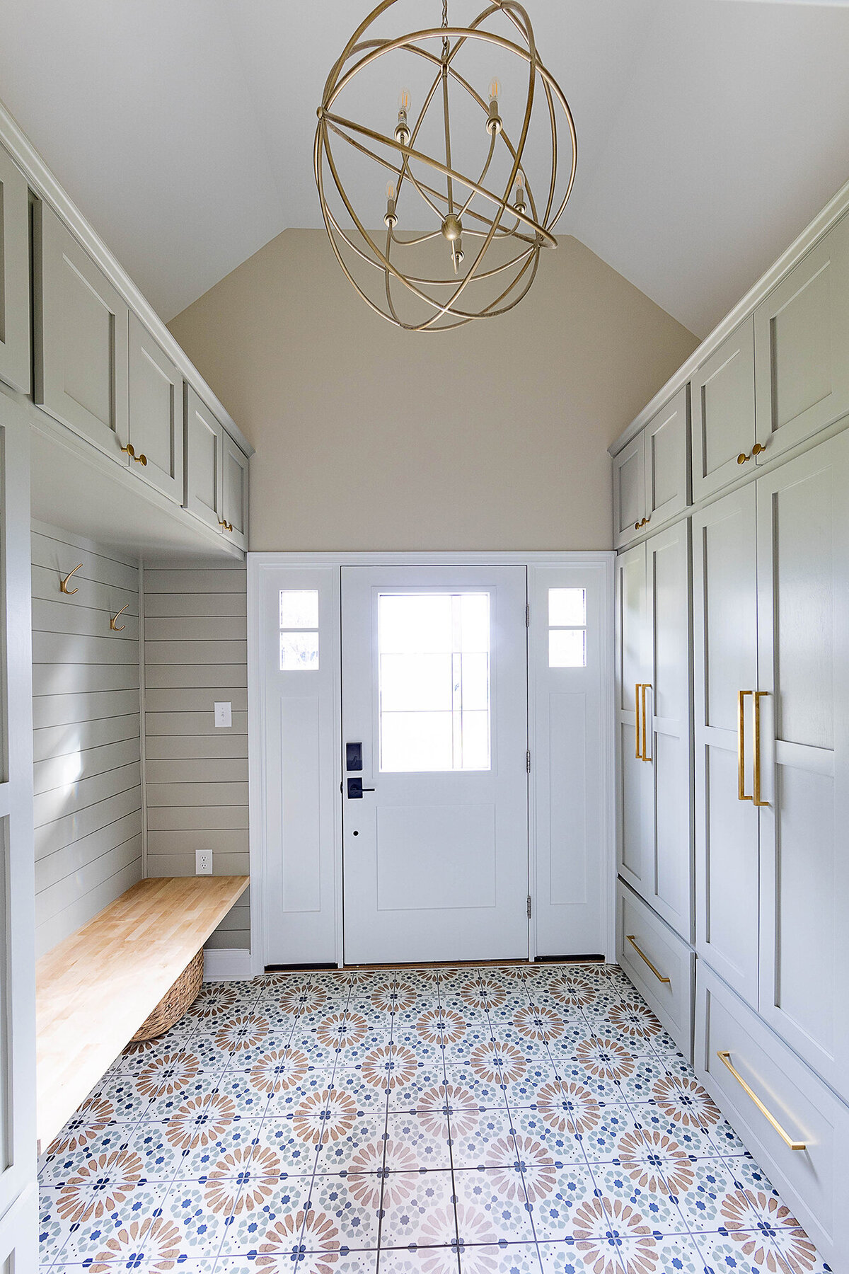 Residential foyer with gold globe light fixture
