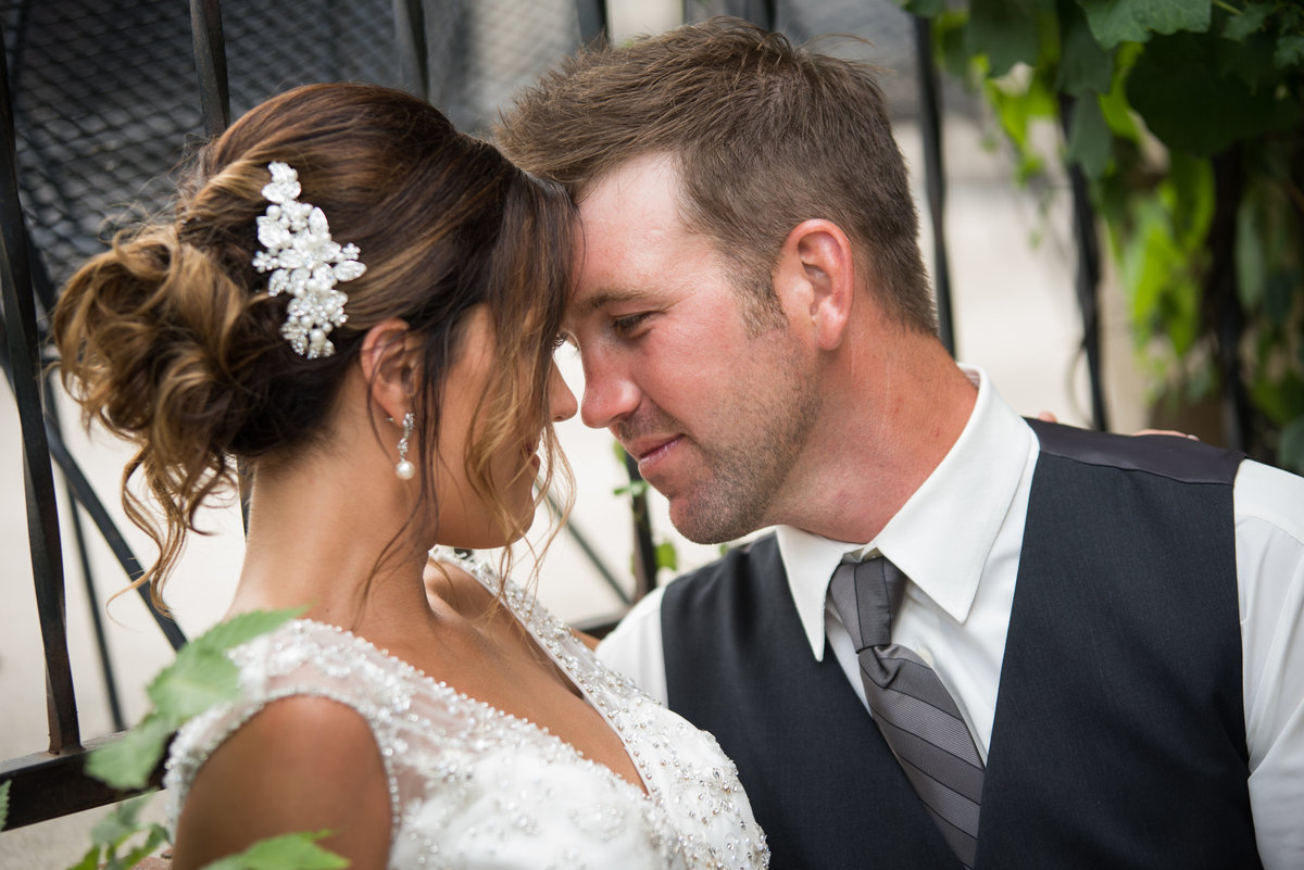 bride and groom looking at eachother touching foreheads