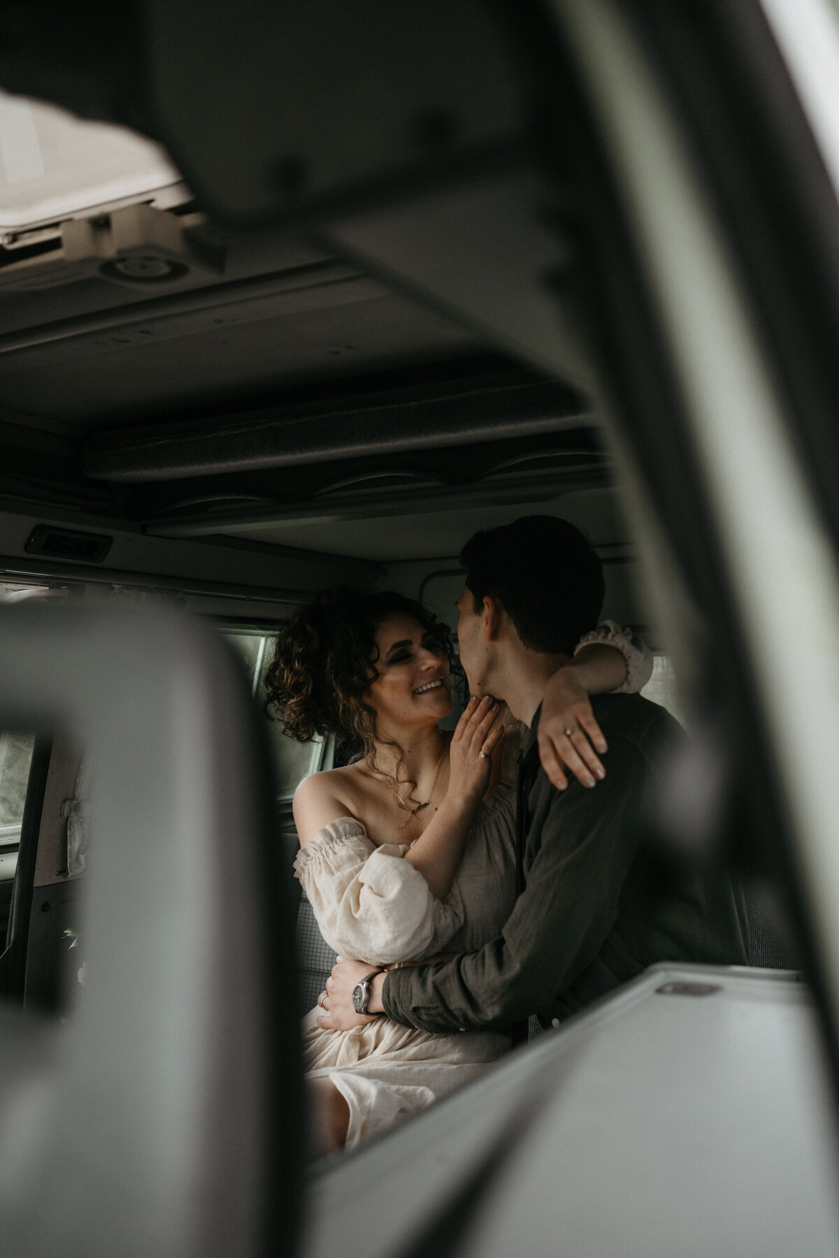 couple embracing in car backseat
