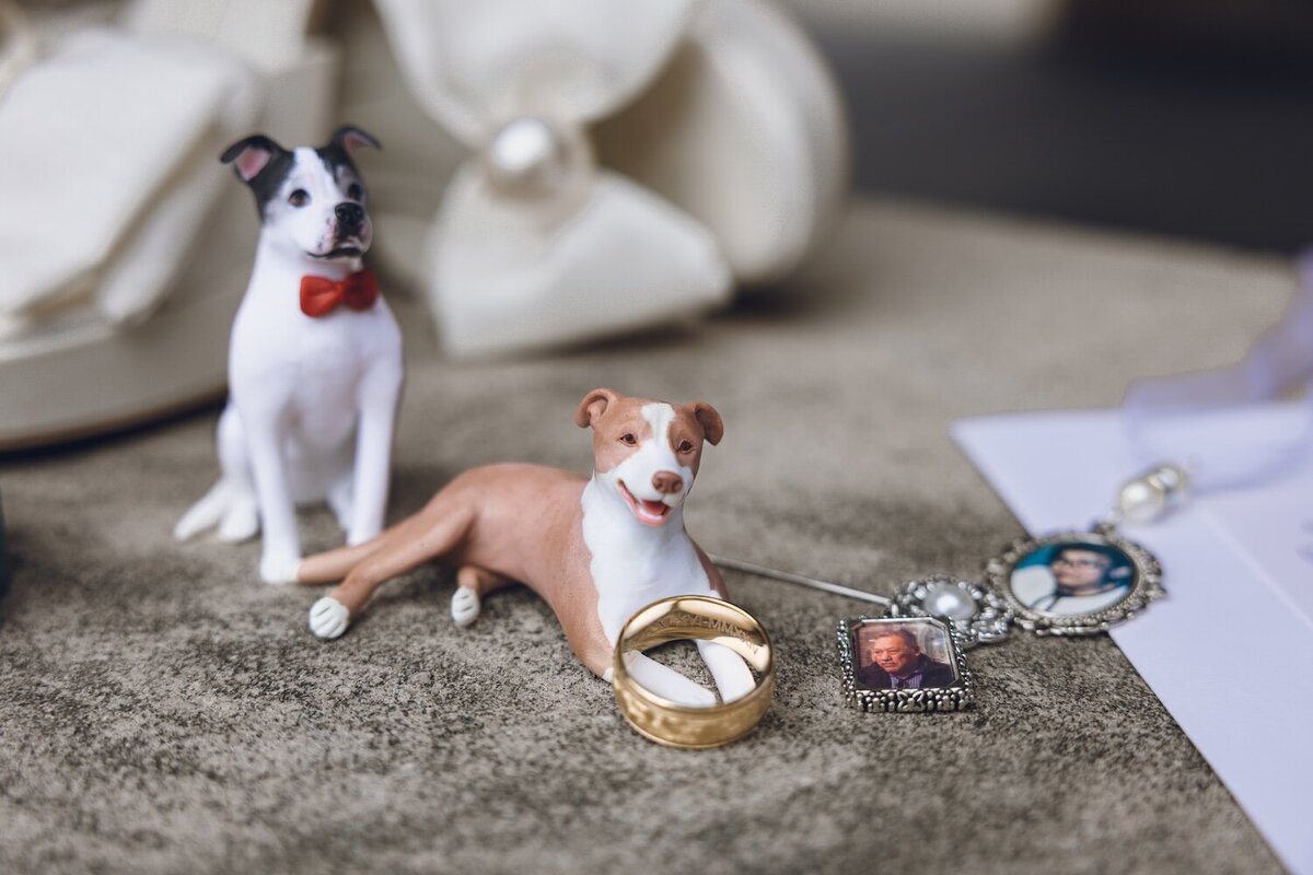 Dog figurines and wedding rings detail at Houston wedding