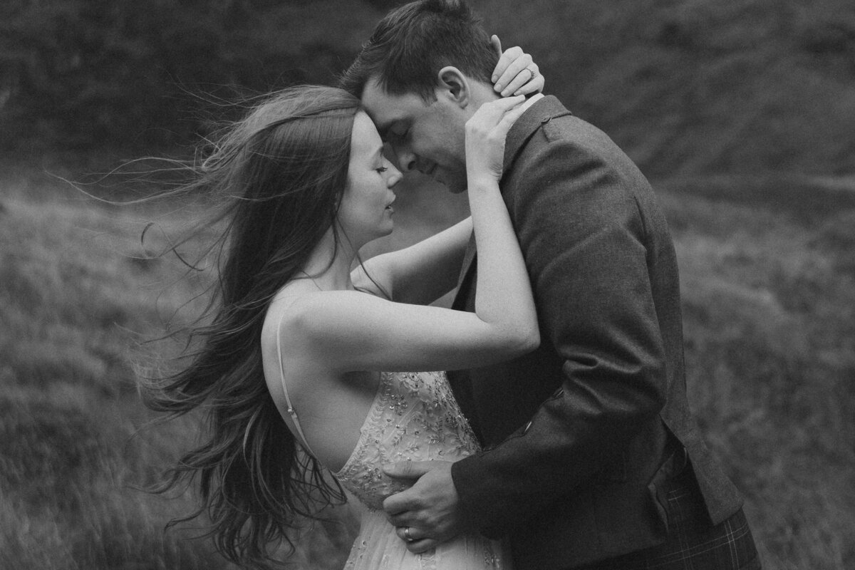 Couple embraces during scotland elopement