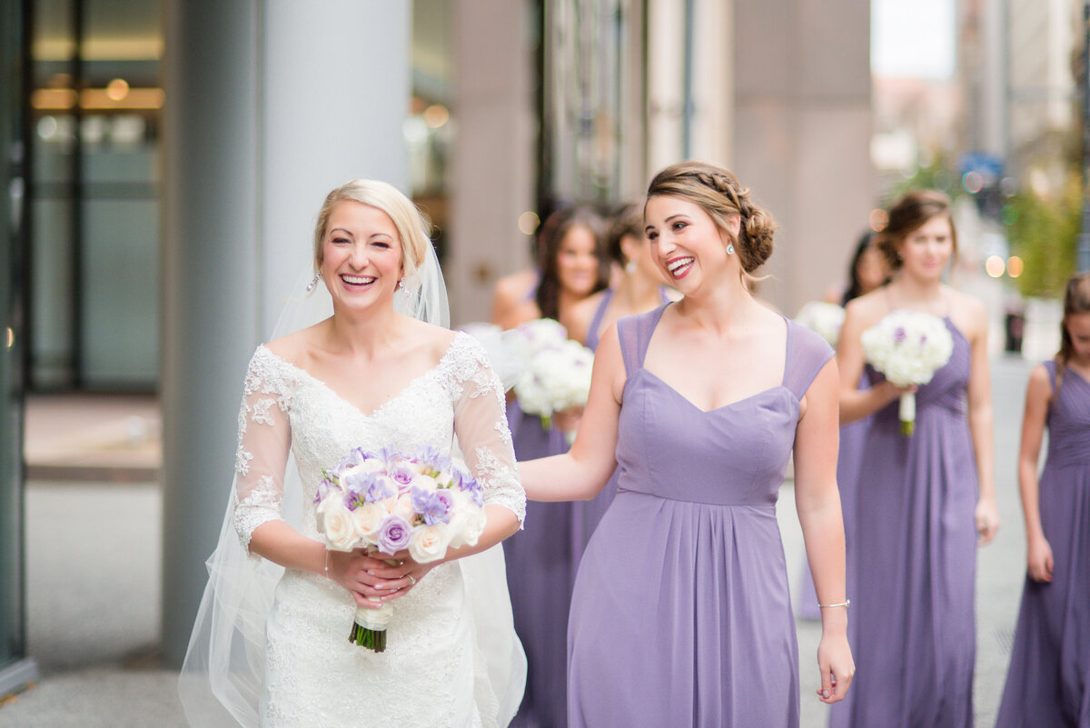 bride walking down street outside of fairmont hotel