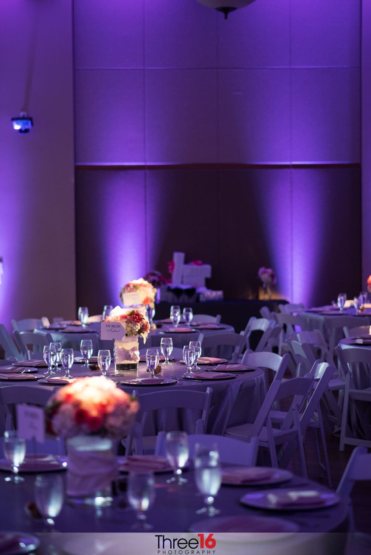 Purple lighting glows at a Bell Tower Community Center wedding reception