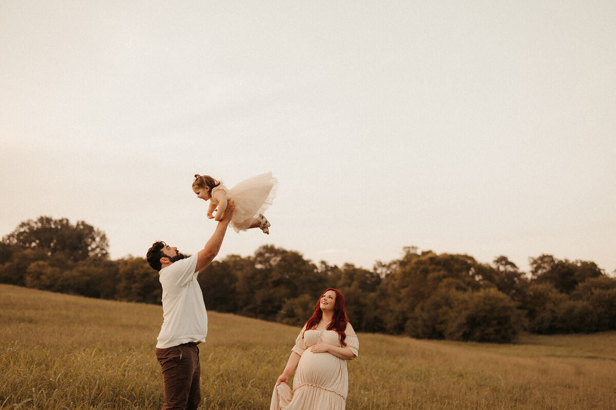 Expecting mother in silk gown during studio maternity photography in Franklin TN