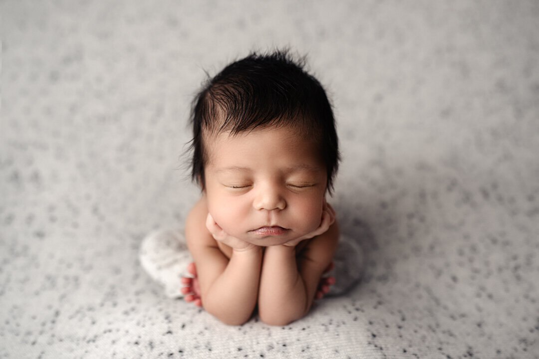 Grand Rapids Newborn Photography Baby resting head on hands by For the Love of Photography