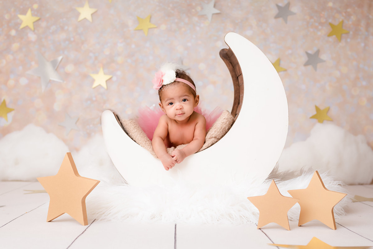 Tummy time while lying on a moon