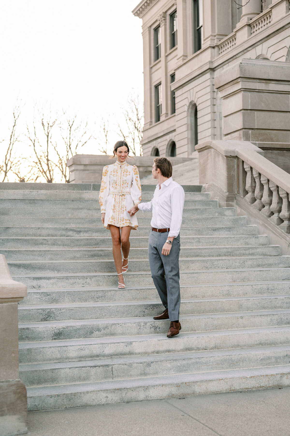 stylish engaged couple at their engagement session in downtown Omaha