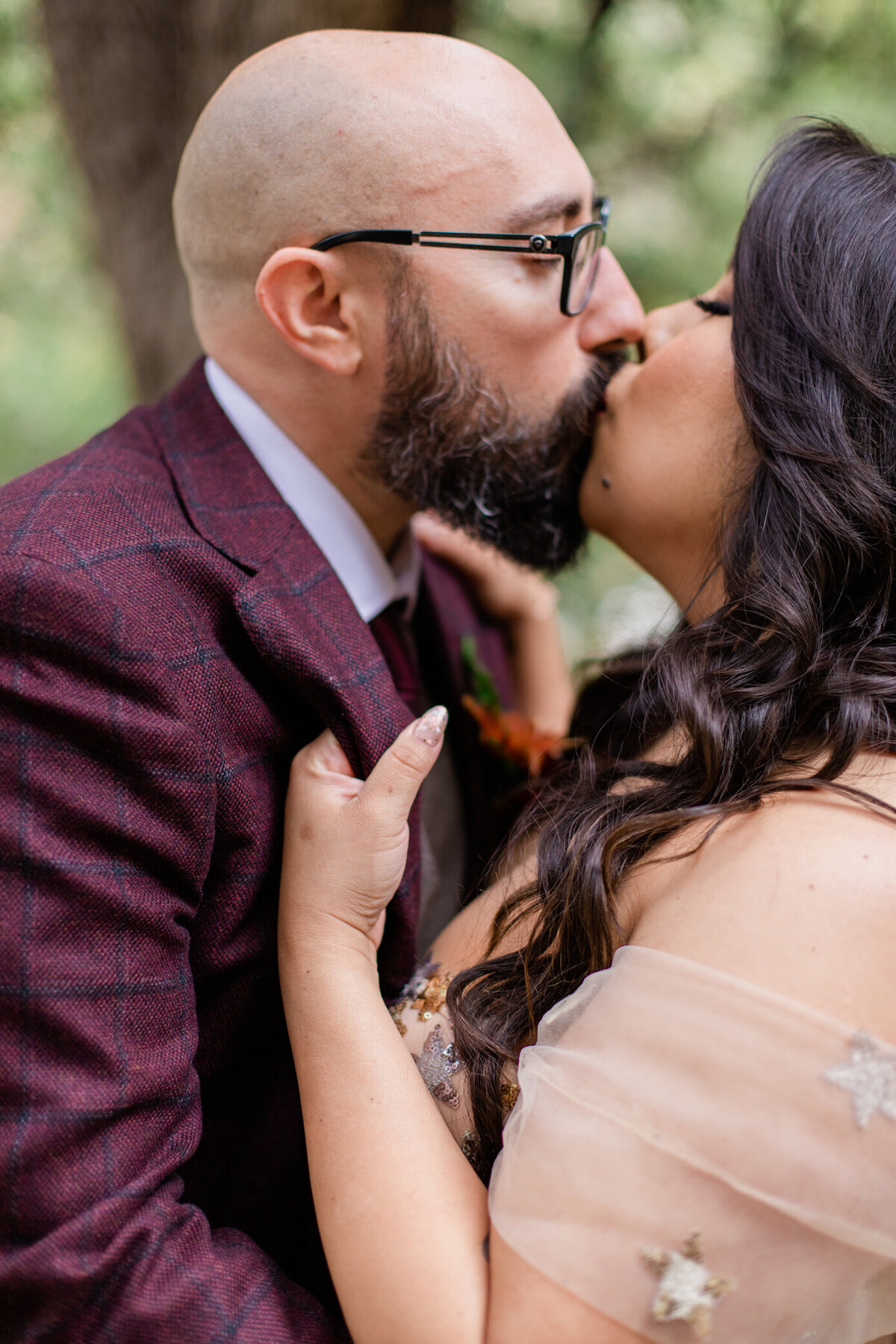 bride passionately kisses groom